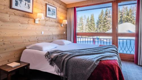 Кровать или кровати в номере Appartement 1 Chambre 4 Personnes MAE-2211