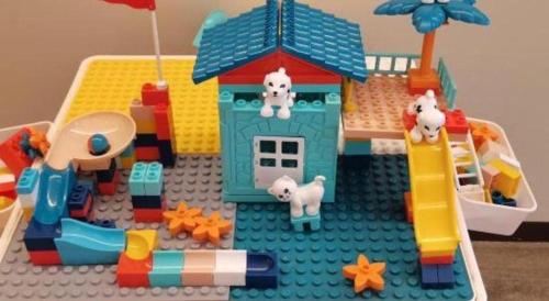 a lego toy house with animals in it at Wanda JIN Baise in Baise
