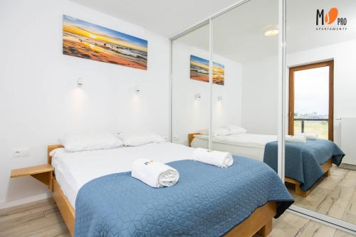 Katil atau katil-katil dalam bilik di Apartamenty BLU Premium Class