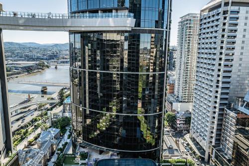 a view of a tall building in a city at Riverside Reverie French Luxury at BNE Casino in Brisbane