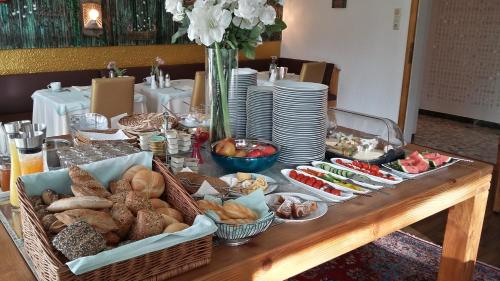 a table with many different types of food on it at Boutique Hotel Oase in Bad Ischl