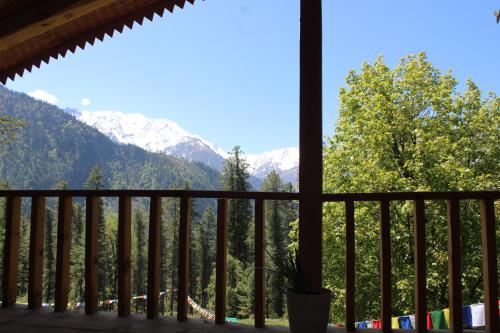 a view from the balcony of the mountains at Mysterious Kutla Cottage,Kutla, Tosh in Chhorang
