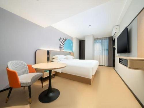 TV a/nebo společenská místnost v ubytování City Comfort Inn Beihai Hepu Bus Terminal