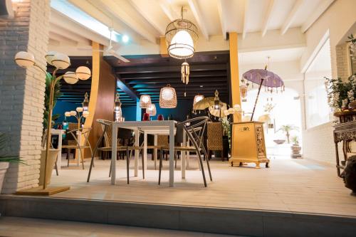 a dining room with a table and chairs at ON Hotels Oceanfront Adults Designed in Matalascañas