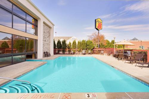a swimming pool at a hotel at Super 8 by Wyndham Hermitage Nashville in Hermitage