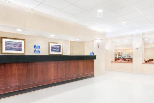 a lobby of a hospital with a reception counter at Days Inn & Suites by Wyndham York in York