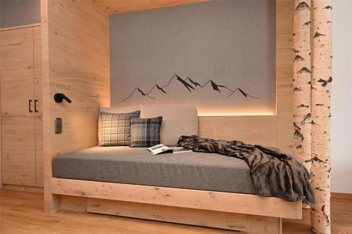 a bedroom with a bed with a sign on the wall at Best Western Plus Hotel Alpenhof in Oberstdorf
