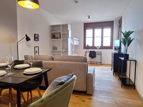 a living room with a couch and a table at Apartment in Gerlitzen with Panoramic Views in Deutschberg