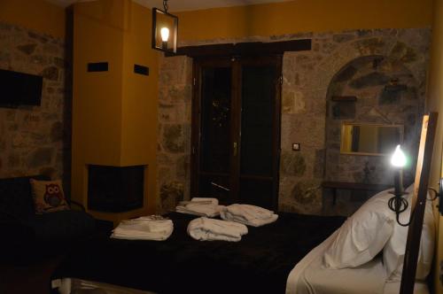 Ένα ή περισσότερα κρεβάτια σε δωμάτιο στο Messana