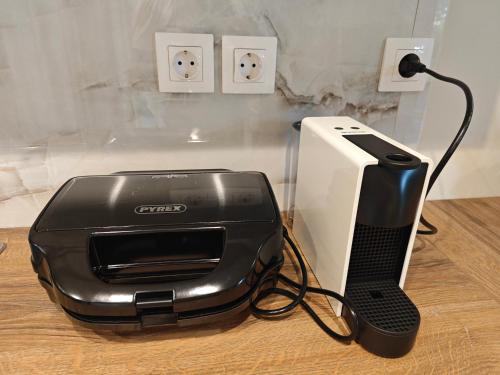 a printer and a computer on a table at Sun And Roses Siviri in Siviri