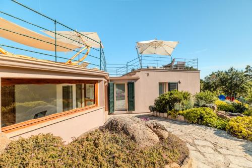 a house with a antenna on top of it at VILLA AMIRA Porto Cervo con vista Mozzafiato sul Mare,Piscina Privata,WELLNESS & SPA in Liscia di Vacca