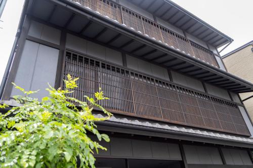 an external view of a building with a balcony at MADOKA Kyoto station west in Kyoto