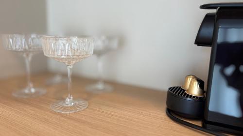 a row of wine glasses sitting on a table at Pušų natos in Druskininkai