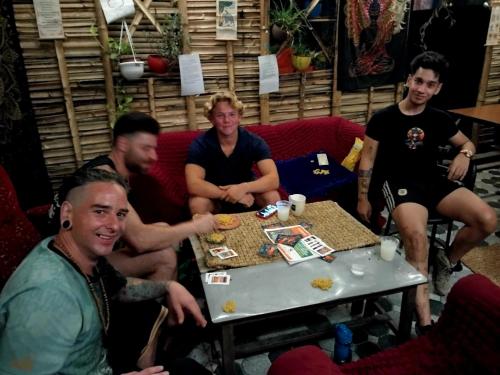 a group of men sitting around a table at Mystic Vibes Fitness Bamboo Cottage in Kathmandu