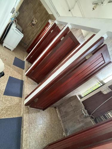 an overhead view of two wooden doors in a room at O'Kane's Pub and Hostel in Chiang Rai