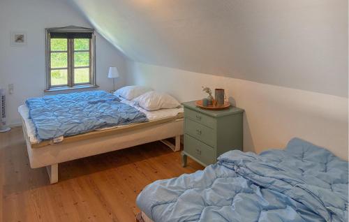 Cama o camas de una habitación en Nice Home In Sakskøbing With Wifi