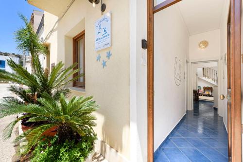 a hallway of a house with plants in it at A' Cavalera in San Vito lo Capo