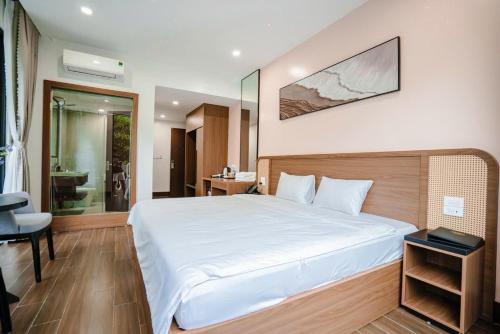 Ένα ή περισσότερα κρεβάτια σε δωμάτιο στο Sunshine Hotel