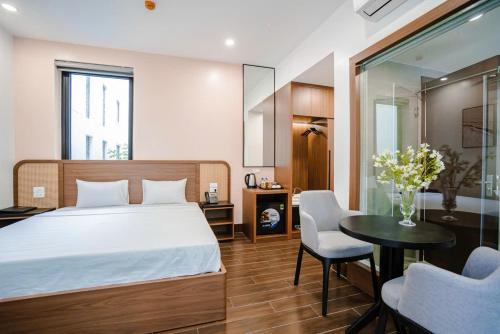 Ένα ή περισσότερα κρεβάτια σε δωμάτιο στο Sunshine Hotel