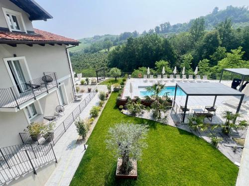 an aerial view of a courtyard with a swimming pool at Dimora Santa Rosalia in Alba