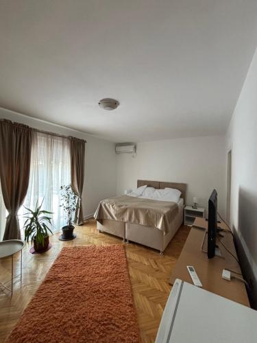 Postel nebo postele na pokoji v ubytování Apartmani IDILA