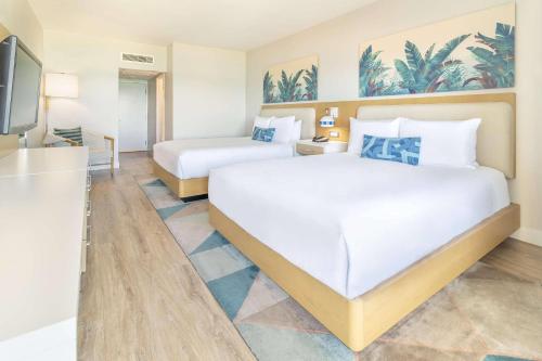 Ένα ή περισσότερα κρεβάτια σε δωμάτιο στο Radisson Resort Miami Beach