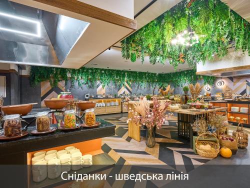 a restaurant with lots of food on display at F&B Spa Resort (ex. Fomich Hotel) in Bukovel