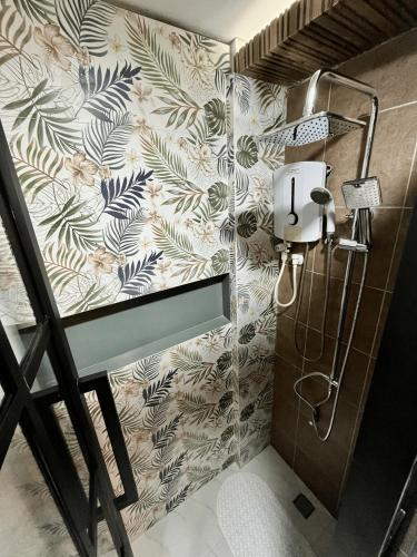 a bathroom with a sink and a shower in it at Funtasea Hotel and Beach Resort in Iba