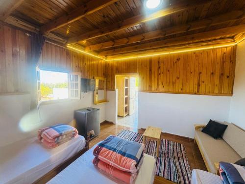a living room with a couch and a table at Dalida House in Dahab