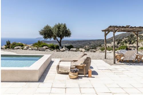 a patio with a pool and a gazebo at Palazzo Greco Villas in Agia Galini