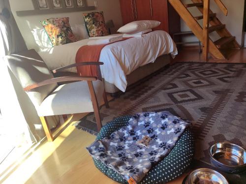 Ένα ή περισσότερα κρεβάτια σε δωμάτιο στο The Loft Getaway