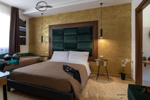 A bed or beds in a room at Diamond