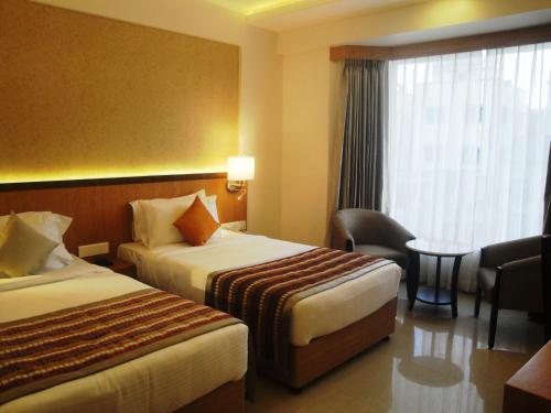Katil atau katil-katil dalam bilik di The Fern Residency, MIDC, Pune