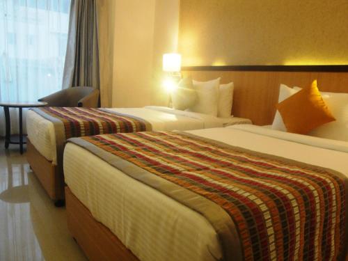 Katil atau katil-katil dalam bilik di The Fern Residency, MIDC, Pune