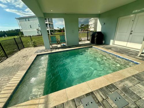 a swimming pool with clear blue water in a house at Baydream Believer at Hunter's Point in Cortez
