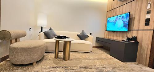 TV a/nebo společenská místnost v ubytování فندق وايت سيزون