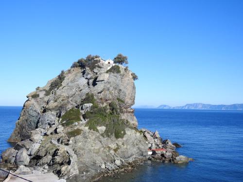 a small island in the middle of the ocean at Dimitra's house in Glóssa