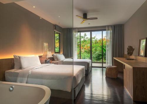 Katil atau katil-katil dalam bilik di Noku Phuket