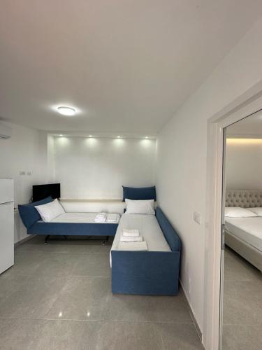 Ένα ή περισσότερα κρεβάτια σε δωμάτιο στο Vila Meli