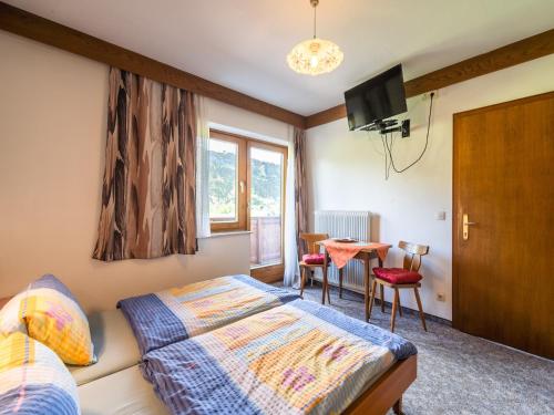 Postel nebo postele na pokoji v ubytování Contemporary Apartment in Maishofen near Ski Area
