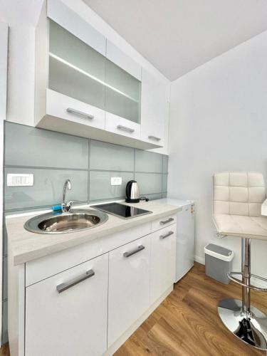 Una cocina o zona de cocina en FOR-A Apartmani