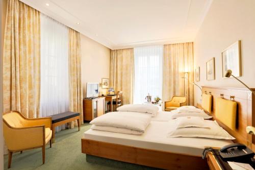 Posteľ alebo postele v izbe v ubytovaní Hotel Reutemann-Seegarten