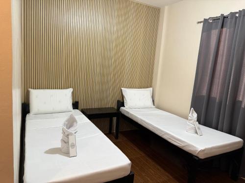 Una cama o camas en una habitación de SOLA Guesthouse