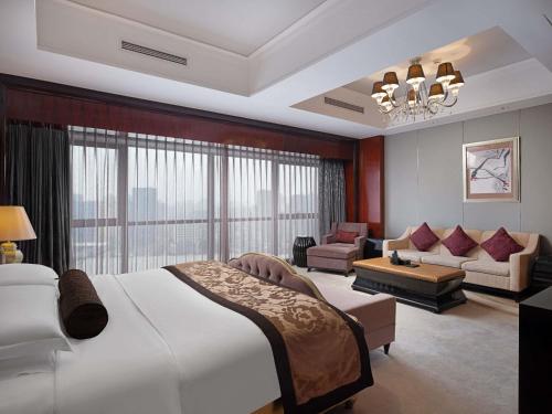 Postel nebo postele na pokoji v ubytování Pullman Shanghai Jingan