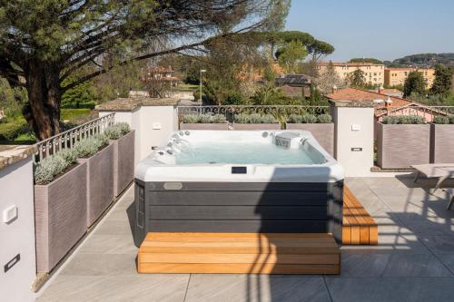 a hot tub sitting on top of a patio at VILLA MADRE Suites e Private Spa in Grottaferrata