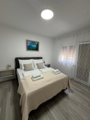 Katil atau katil-katil dalam bilik di Apartments Iskra