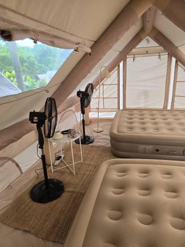 a room with two microphones in a tent at Fresia Villa & Camping in Beranang