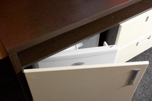 an open drawer of a desk with a white computer system at Ай Сафия Hotel in Sudak