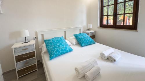 Кровать или кровати в номере Casa Sole e Mare by Sardinianworld