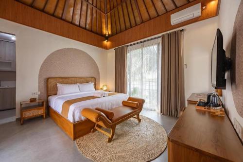 Кровать или кровати в номере Banjar Segara Villa & Guesthouse - Kelating